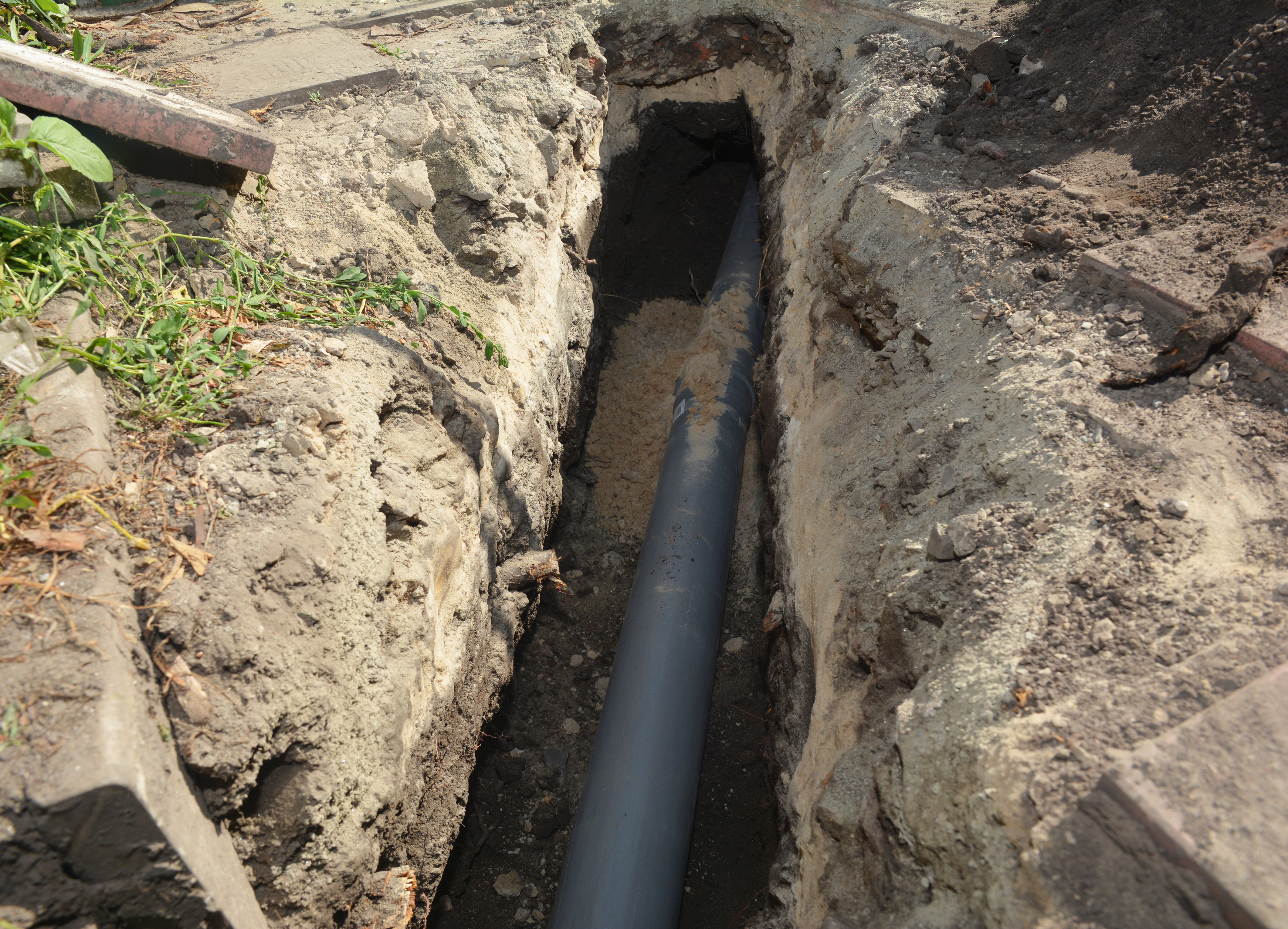 Sewer line replacement with trench excavated